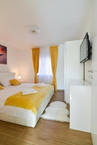 Posteľ alebo postele v izbe v ubytovaní Sunset Gold