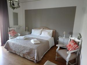 מיטה או מיטות בחדר ב-B&B Casa Vienna