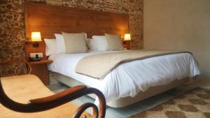Posteľ alebo postele v izbe v ubytovaní Hotel Casa de las Cuatro Torres