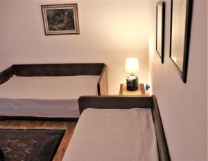 Voodi või voodid majutusasutuse Lemon tree villa toas