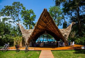 a pavilion with bikes parked in the grass at Le Cameleon Boutique Hotel in Puerto Viejo