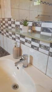 A bathroom at Bajusz Vendégház