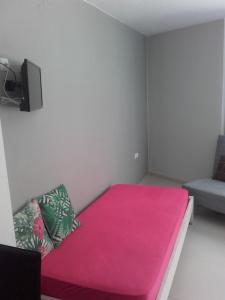 Postel nebo postele na pokoji v ubytování Errica Apartment
