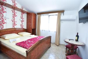 Postel nebo postele na pokoji v ubytování Hotel Grbalj