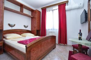 Postel nebo postele na pokoji v ubytování Hotel Grbalj