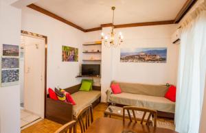 Telewizja i/lub zestaw kina domowego w obiekcie Cosy apartment for 4