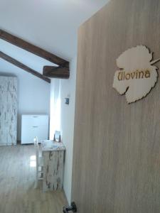 a room with a table and a sign that says albuquerque at Casa Rossa Motovun in Motovun