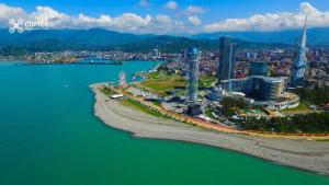 an aerial view of a city next to the water at Hotel Ergo in Batumi