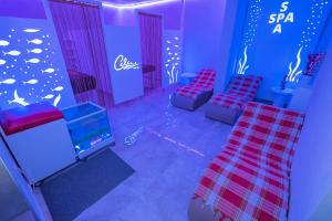 a room with two chairs and a fish wall at Kleopatra Celine Hotel in Alanya