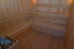 an empty sauna with wooden flooring and a wooden at Kleopatra Celine Hotel in Alanya