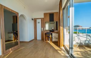 a living room with a view of the ocean at Kleopatra Celine Hotel in Alanya
