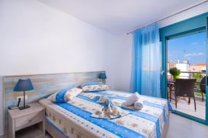 מיטה או מיטות בחדר ב-Villa Tasos-Potos Thassos