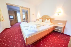 Ein Bett oder Betten in einem Zimmer der Unterkunft Superior Hotel Persal
