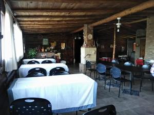 a room with four beds with faces on the fronts at Posada la Cabaña in Villa Tulumba