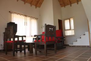 Een zitgedeelte bij Alcalá Cabañas Campestres +12 foto's