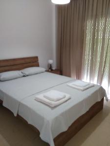 Ένα ή περισσότερα κρεβάτια σε δωμάτιο στο Gorginas Home