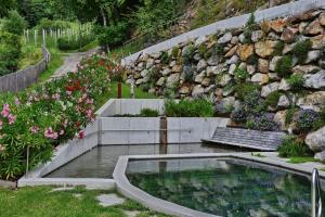 A garden outside Residence Blumenthalerhof