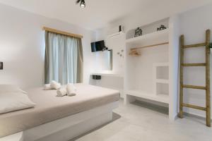 Кровать или кровати в номере Naxos Colosseo