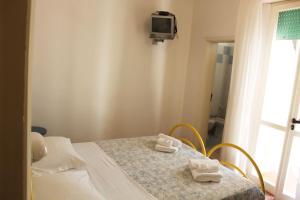 Cama o camas de una habitación en Hotel Elde