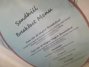 a page of a menu on a plate at The Sandhill in Sandown