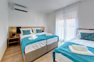 Villa Floris tesisinde bir odada yatak veya yataklar