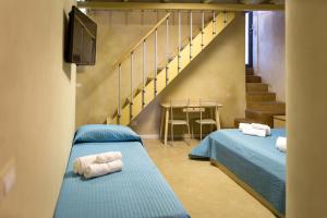 A bed or beds in a room at Casa della Palma