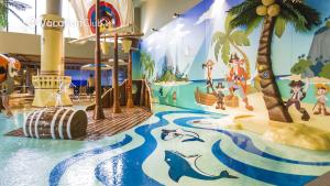 a water park with a water slide and dolphins at VacationClub - Baltic Park Molo Apartment D110 in Świnoujście
