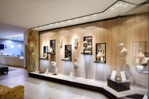 a display case in a museum with a bunch of statues at Alexandra Beach Spa Resort in Potos