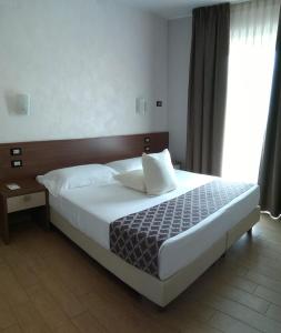 Postel nebo postele na pokoji v ubytování Hotel Residence Eden