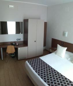 Postel nebo postele na pokoji v ubytování Hotel Residence Eden