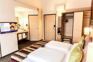 Letto o letti in una camera di TUI BLUE Schladming