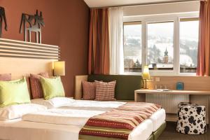 Letto o letti in una camera di TUI BLUE Schladming