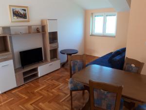 A television and/or entertainment centre at Apartments Horvat on Island Pag
