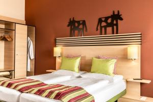 Letto o letti in una camera di TUI BLUE Schladming