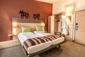 Letto o letti in una camera di TUI BLUE Schladming