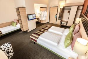 Letto o letti in una camera di TUI BLUE Schladming