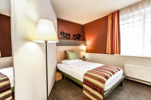 Letto o letti in una camera di TUI BLUE Schladming