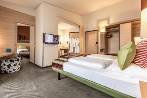 Letto o letti in una camera di TUI BLUE Schladming