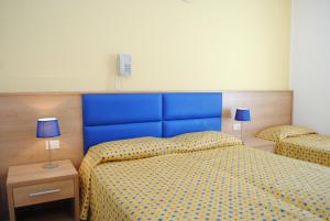 Postel nebo postele na pokoji v ubytování Hotel Eraclea