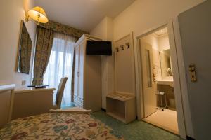 TV a/nebo společenská místnost v ubytování Hotel Nord Est