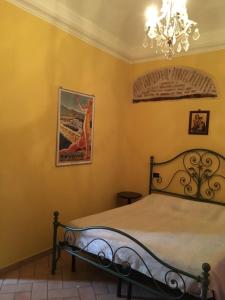 A bed or beds in a room at Amber Apartment