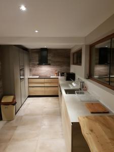 a kitchen with a sink and a counter top at Mihaylova kushta in Lyubosh