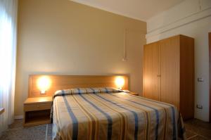 Postel nebo postele na pokoji v ubytování Hotel Moderno