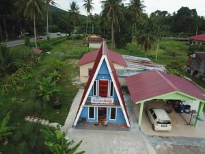 an overhead view of a small house with a red roof at Panorama Homestay in Jeram