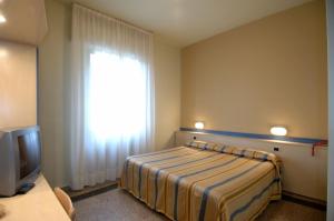 Postel nebo postele na pokoji v ubytování Hotel Moderno
