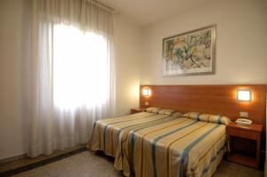 Postel nebo postele na pokoji v ubytování Hotel Moderno