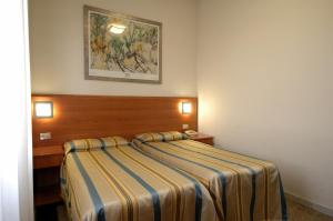 Postel nebo postele na pokoji v ubytování Hotel Moderno