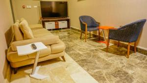 TV a/nebo společenská místnost v ubytování Extenso Hotel