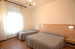 Postel nebo postele na pokoji v ubytování Hotel Moderno