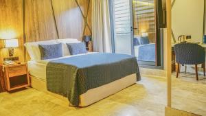 Postel nebo postele na pokoji v ubytování Extenso Hotel
